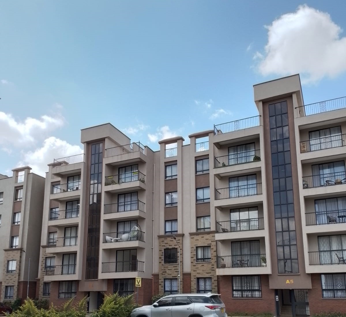 The development is located near SGR and Gateway Mall.
Special features include:
Spacious lounge with balcony; master ensuite with walkin closet; underground water storage; open terrace and party area; internet and TV access points; 24hr manned security with CCTV; fully fitted solar panels; spacious pantry and wash areas; children's play areas; fully fitted gym; designer kitchens and wash areas; sufficient parking.
2-bedroom units (98 square meters) selling for Kshs. 7.8m while 3-bedroom units (120 square meters) are selling for Kshs. 9.2m only. Rent charged for 2-bedroom units in the development is Kshs. 42,000 whereas for 3-bedroom units is Kshs. 52,000 only. Secure neighborhood.
Get in touch to schedule a viewing. Entire development sits on a 5-acre lot approximately and comprises 16 blocks each having 5 floors per block and 2 units per floor.